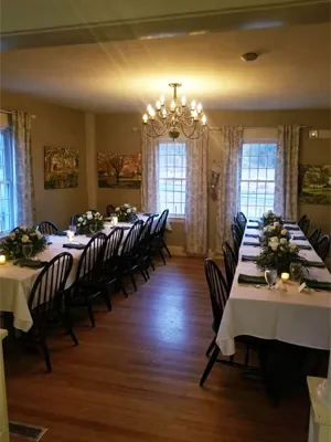 A long table with many chairs in the middle of it