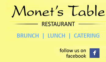 A yellow sign with the words " monet 's town restaurant " written in black.